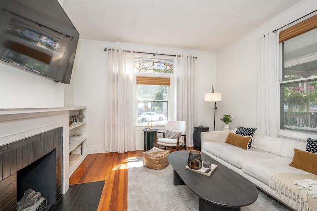 1915 Scott St, Covington, KY 41014 - living area with hardwood / wood-style flooring and a fireplace with flush hearth