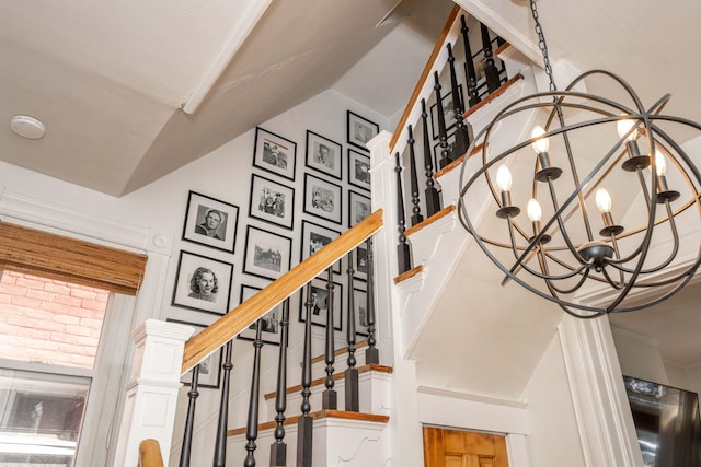 1915 Scott St, Covington, KY 41014 - stairs with a chandelier and vaulted ceiling