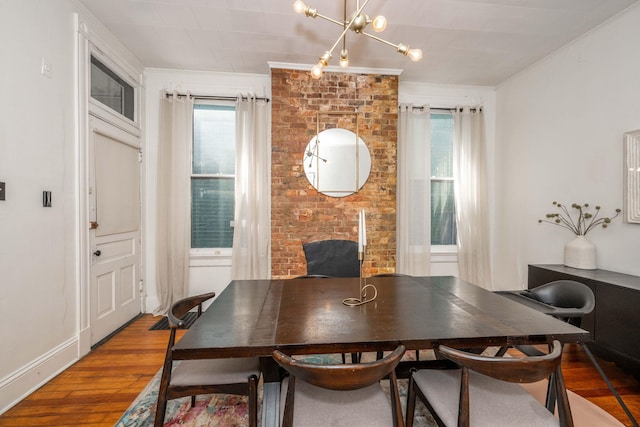 1915 Scott St, Covington, KY 41014 - dining room featuring hardwood / wood-style flooring, healthy amount of natural light, ornamental molding, and a chandelier