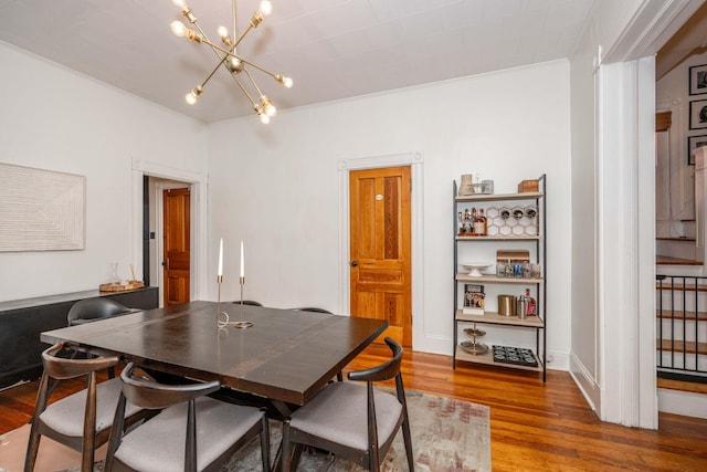 1915 Scott St, Covington, KY 41014 - dining area featuring a chandelier and wood finished floors