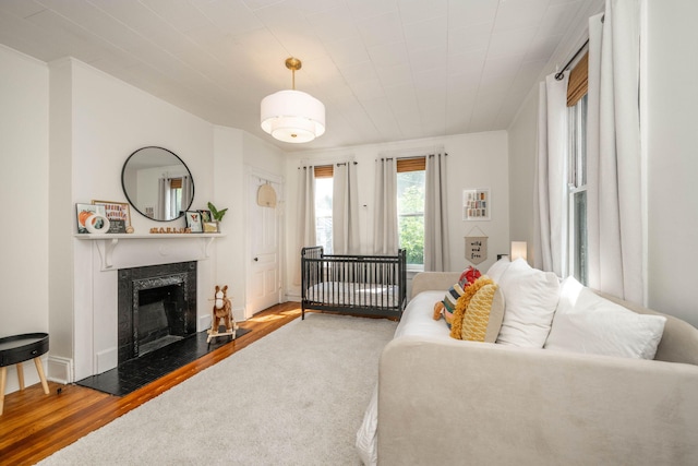 1915 Scott St, Covington, KY 41014 - living room featuring a fireplace and wood finished floors