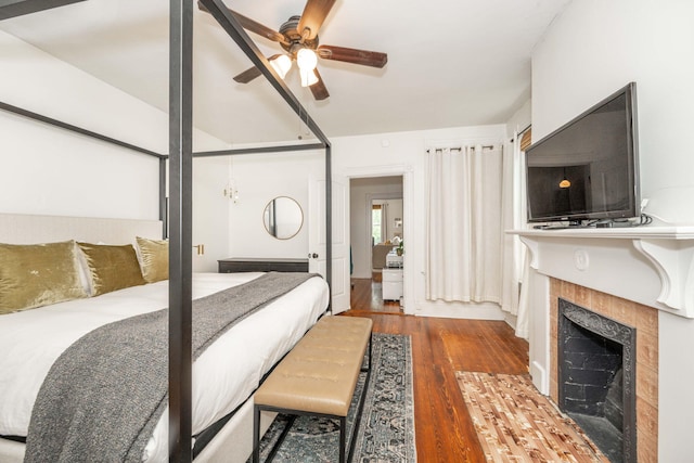1915 Scott St, Covington, KY 41014 - bedroom with wood finished floors and a tile fireplace