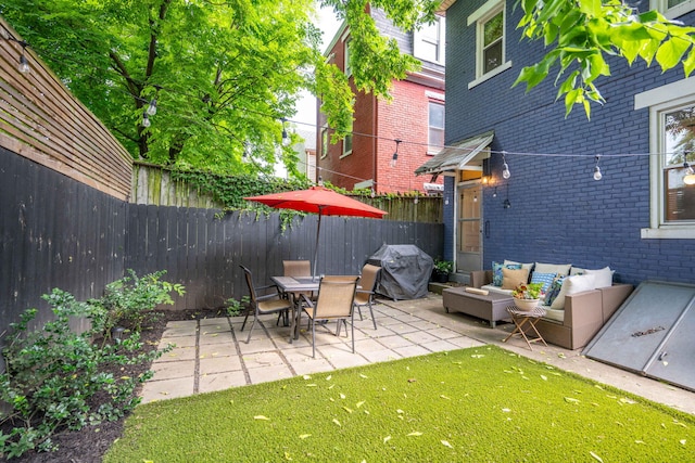 1915 Scott St, Covington, KY 41014 - fenced backyard featuring area for grilling, a patio area, and outdoor lounge area