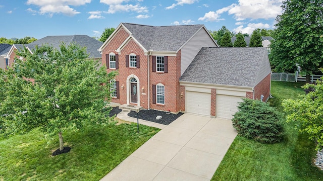 2282 Berkshire Ct, Florence, KY 41042 - colonial inspired home featuring an attached garage, brick siding, concrete driveway, and roof with shingles