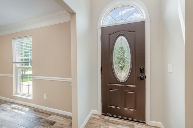 2282 Berkshire Ct, Florence, KY 41042 - foyer with healthy amount of natural light, light wood finished floors, and ornamental molding