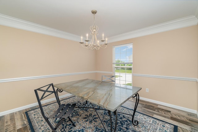 2282 Berkshire Ct, Florence, KY 41042 - dining room with crown molding, a chandelier, and wood finished floors