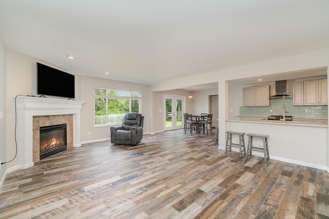 2282 Berkshire Ct, Florence, KY 41042 - living room with light wood-style floors, a tiled fireplace, and recessed lighting