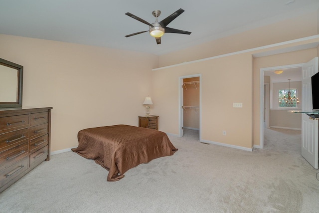 2282 Berkshire Ct, Florence, KY 41042 - carpeted bedroom featuring a walk in closet, a closet, and ceiling fan
