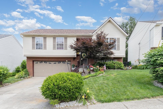 9171 Tamarack Dr, Covington, KY 41017 - raised ranch featuring a garage, concrete driveway, a front yard, and brick siding