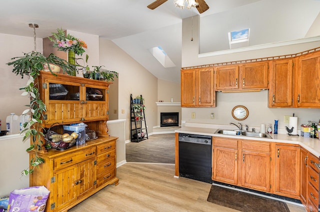 9171 Tamarack Dr, Covington, KY 41017 - kitchen featuring dishwasher, light wood-type flooring, a skylight, light countertops, and a ceiling fan