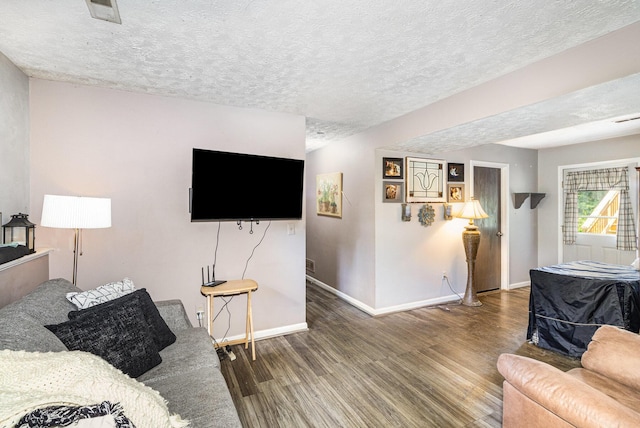 9171 Tamarack Dr, Covington, KY 41017 - living room featuring wood finished floors and a textured ceiling
