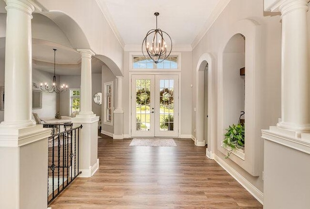 1217 Citation Dr, Union, KY 41091 - entrance foyer with a chandelier, crown molding, french doors, wood finished floors, and arched walkways