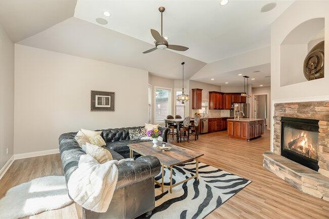 1217 Citation Dr, Union, KY 41091 - living area featuring a ceiling fan, lofted ceiling, a fireplace, and light wood finished floors