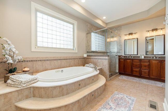 1217 Citation Dr, Union, KY 41091 - bathroom with a garden tub, double vanity, plenty of natural light, a stall shower, and recessed lighting