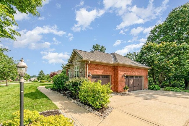 1217 Citation Dr, Union, KY 41091 - view of side of home featuring brick siding, a garage, a yard, and concrete driveway