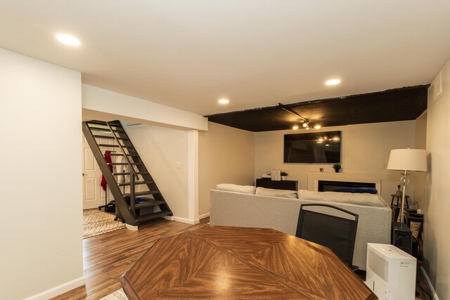 3141 Riggs Ave, Erlanger, KY 41018 - dining space featuring wood finished floors, stairs, a fireplace, recessed lighting, and track lighting