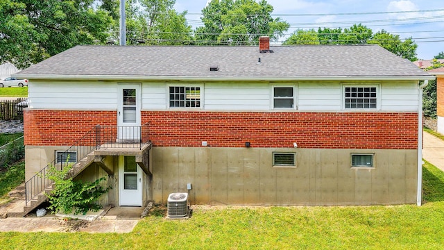 3141 Riggs Ave, Erlanger, KY 41018 - back of property featuring stairs, roof with shingles, a chimney, and brick siding