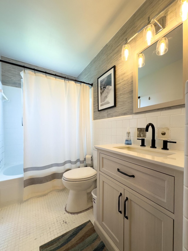 3141 Riggs Ave, Erlanger, KY 41018 - bathroom featuring tile walls, tile patterned flooring, vanity, shower / bath combo, and a wainscoted wall