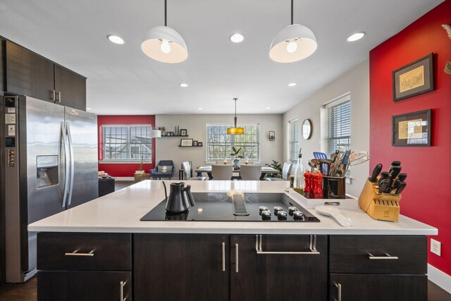 202 W 13th St, Newport, KY 41071 - kitchen with stainless steel refrigerator with ice dispenser, light countertops, black electric cooktop, dark brown cabinets, and recessed lighting