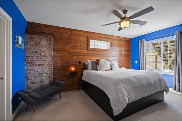 202 W 13th St, Newport, KY 41071 - bedroom with wooden walls, carpet flooring, and ceiling fan