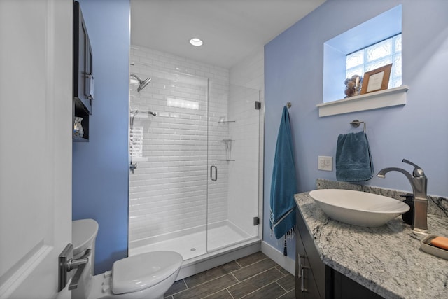 202 W 13th St, Newport, KY 41071 - bathroom featuring vanity, a stall shower, and wood finish floors