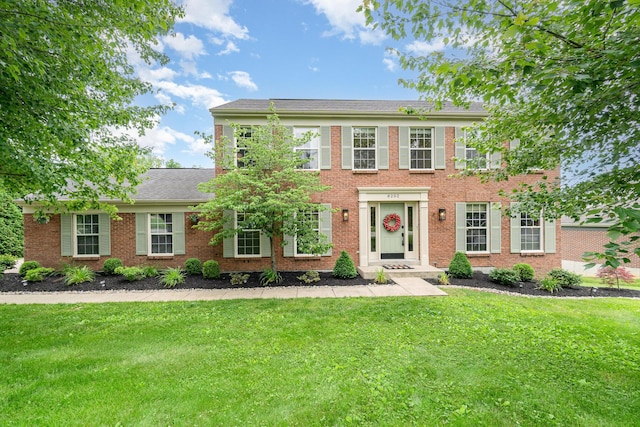 8202 Heatherwood Dr, Florence, KY 41042 - colonial house with a front lawn and brick siding