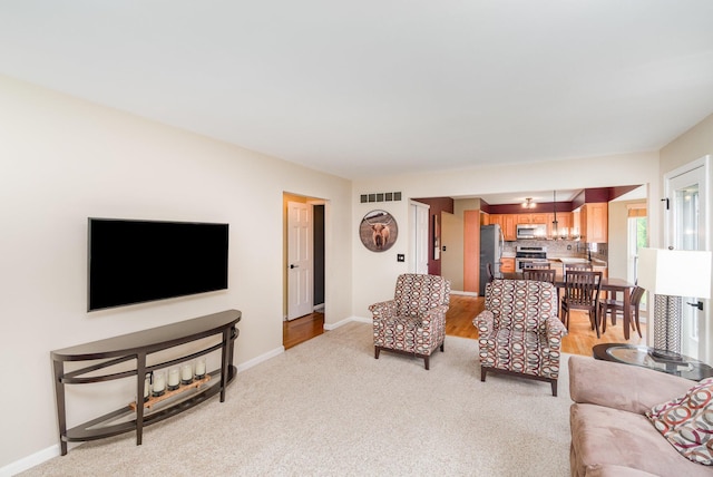 8202 Heatherwood Dr, Florence, KY 41042 - living area featuring baseboards and light carpet