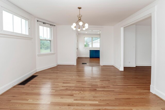 61 Biehl St, Newport, KY 41071 - spare room featuring a chandelier and light wood finished floors