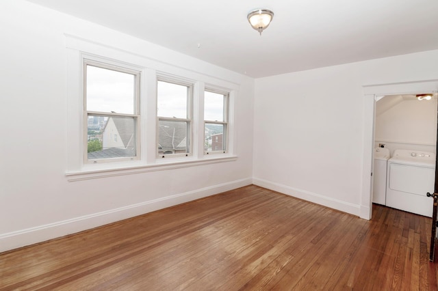 61 Biehl St, Newport, KY 41071 - spare room with washing machine and dryer and hardwood / wood-style floors