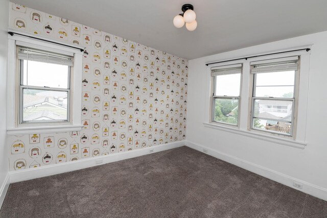 61 Biehl St, Newport, KY 41071 - spare room featuring dark colored carpet, wallpapered walls, and plenty of natural light