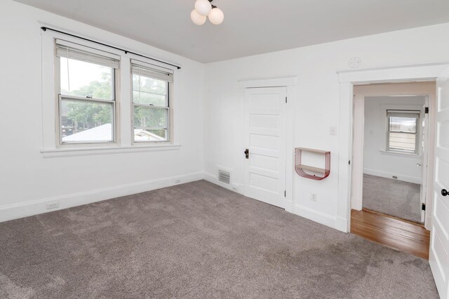 61 Biehl St, Newport, KY 41071 - unfurnished bedroom with carpet flooring, a closet, and heating unit