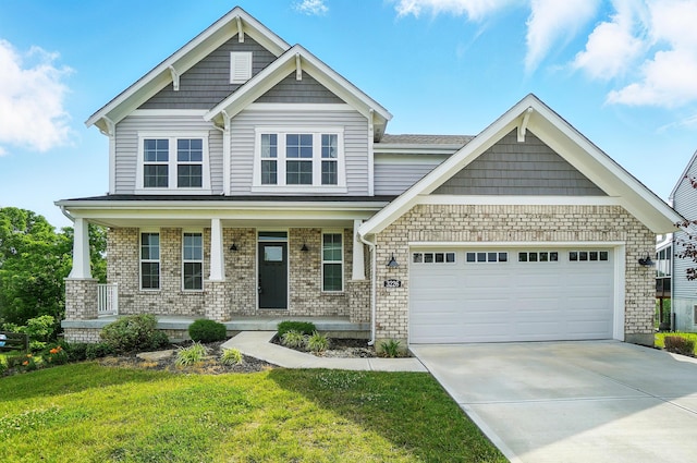 3226 Chloe Ct, Hebron, KY 41048 - craftsman house featuring an attached garage, concrete driveway, a front yard, a porch, and brick siding