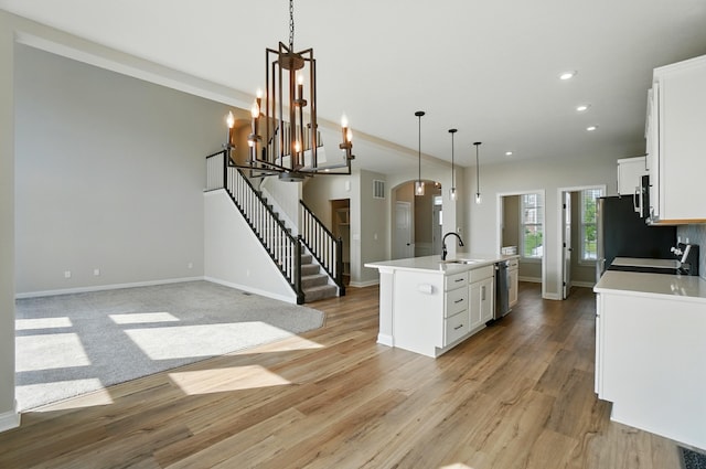 3226 Chloe Ct, Hebron, KY 41048 - kitchen with light countertops, white cabinets, a kitchen island with sink, light wood-style floors, and recessed lighting