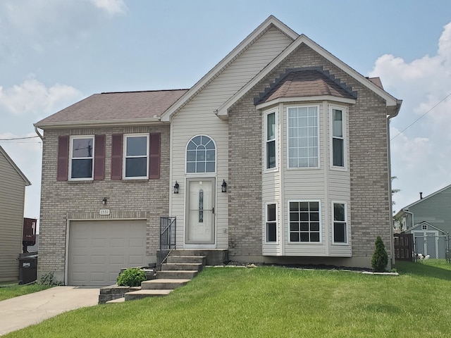 1531 Clovernook Dr, Elsmere, KY 41018 - view of front of house featuring driveway, a front yard, a garage, and brick siding