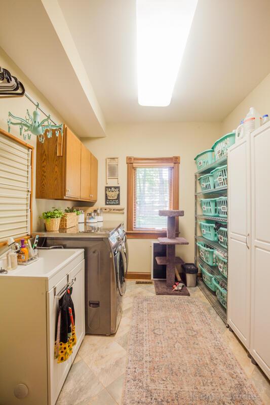 2507 Woodstone Way, Villa Hills, KY 41017 - laundry room with cabinet space and washing machine and clothes dryer