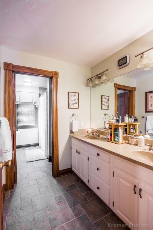 2507 Woodstone Way, Villa Hills, KY 41017 - full bathroom featuring double vanity and stone tile floors