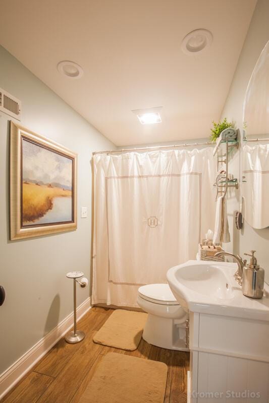 2507 Woodstone Way, Villa Hills, KY 41017 - bathroom featuring wood finished floors, vanity, and shower / bathtub combination with curtain