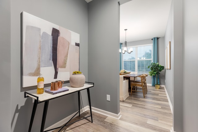 2320 Daybloom Ct, Hebron, KY 41048 - corridor with light wood finished floors and a chandelier