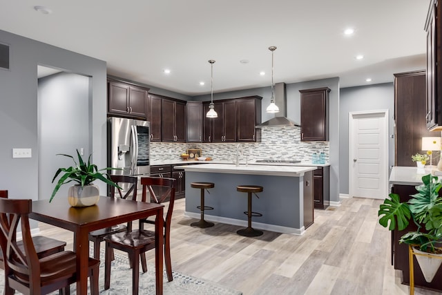 2320 Daybloom Ct, Hebron, KY 41048 - kitchen with wall chimney range hood, stainless steel fridge with ice dispenser, dark brown cabinetry, backsplash, and recessed lighting