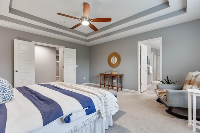 2320 Daybloom Ct, Hebron, KY 41048 - bedroom with a raised ceiling, carpet flooring, connected bathroom, and ceiling fan