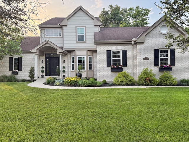 1169 Appomattox Dr, Florence, KY 41042 - view of front of property featuring brick siding, a front lawn, and a shingled roof