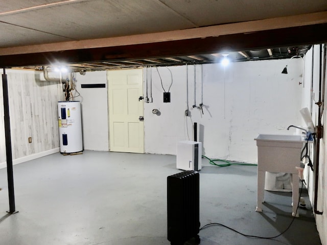 311 Elk Lake Rd, Owenton, KY 40359 - unfinished basement featuring electric water heater and wood walls