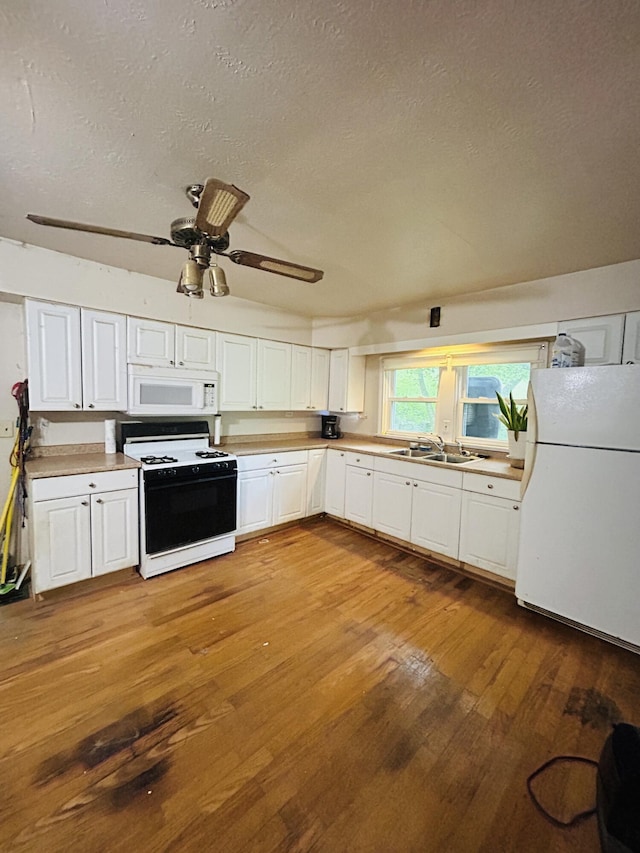 10061 Persimmon Grove Pike, Alexandria, KY 41001 - kitchen with white appliances, a textured ceiling, white cabinetry, wood finished floors, and light countertops