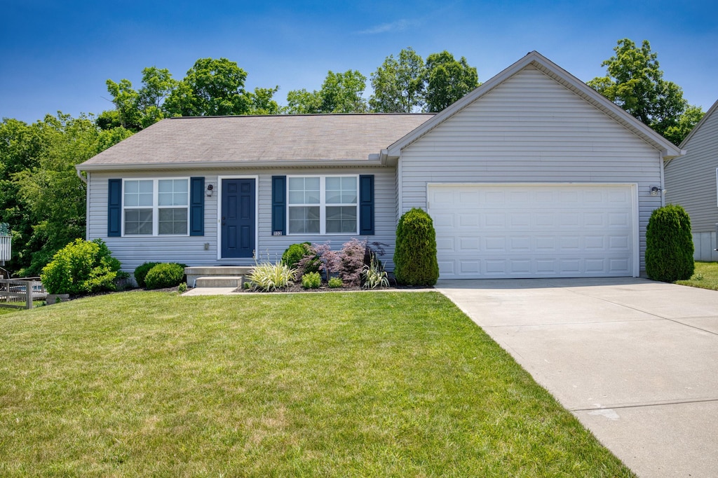 1132 Gemstone Pointe Dr, Walton, KY 41094 - single story home with an attached garage, concrete driveway, and a front lawn