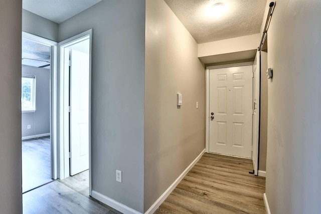 436 Marian Ln Unit 2, Florence, KY 41042 - hall featuring light wood-style floors and a textured ceiling