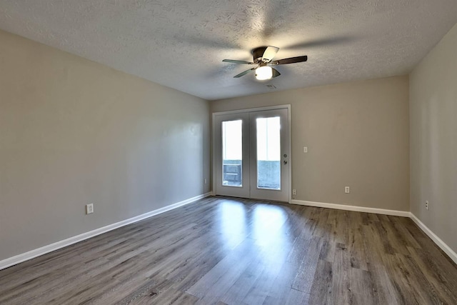 436 Marian Ln Unit 2, Florence, KY 41042 - empty room with dark wood-style floors, a textured ceiling, and a ceiling fan