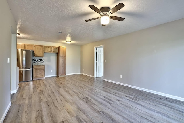 436 Marian Ln Unit 2, Florence, KY 41042 - unfurnished living room featuring wood finished floors, a textured ceiling, and ceiling fan
