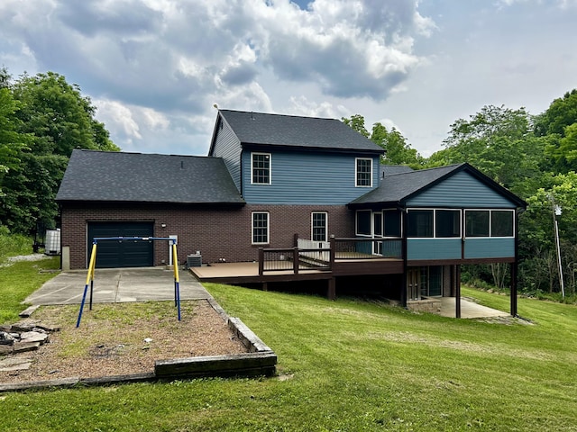 1756 Paxton Rd, Morning View, KY 41063 - back of property with an attached garage, a sunroom, a deck, and brick siding