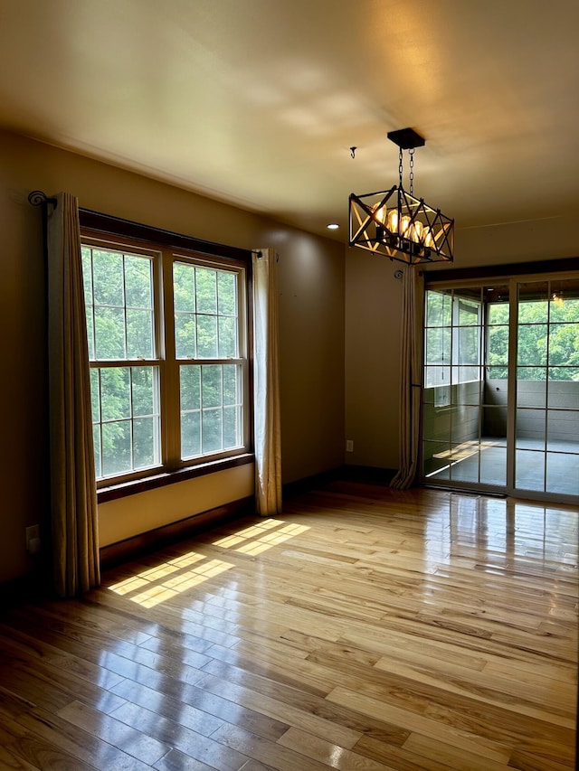 1756 Paxton Rd, Morning View, KY 41063 - empty room featuring a chandelier and wood finished floors