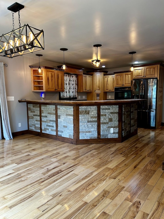 1756 Paxton Rd, Morning View, KY 41063 - kitchen featuring black appliances, light wood-type flooring, dark countertops, and decorative light fixtures